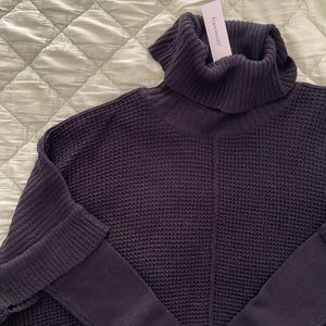 Francesca’s oversized turtle neck sweater